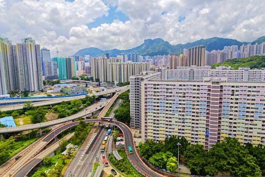 hong kong public estate with landmark lion rock at day