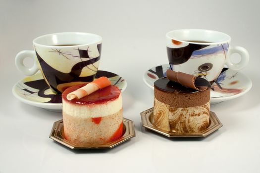 Tasteful Chocolate Pastry mousse and Fruit Pastry made of passion fruit with cup of coffee