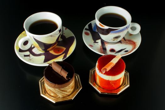 Tasteful Chocolate Pastry mousse and Fruit Pastry made of passion fruit with cup of coffee