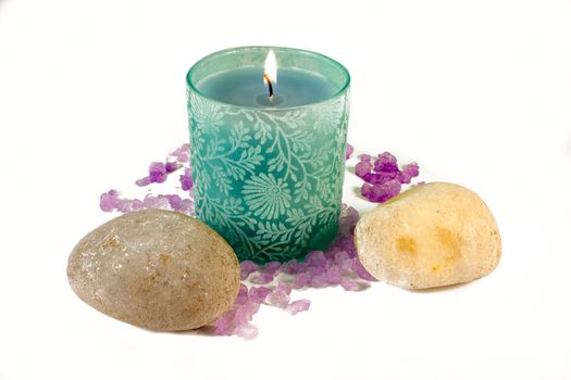 Green candle with purple aromatic sea salt