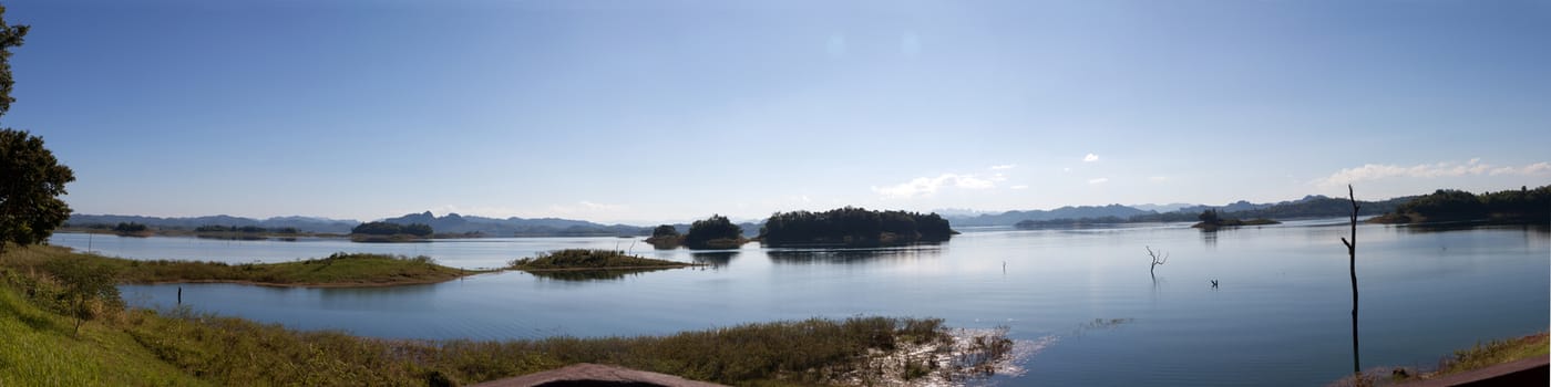 Blue sky and reflection in the water. panorama reservoir in thailand.