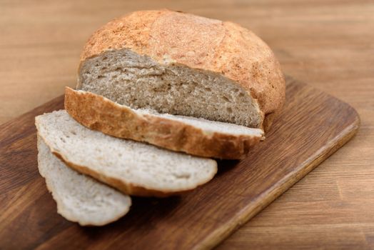 grain bread is sliced on the Board