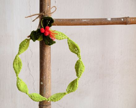 Diy Christmas wreath for decoration the door on Xmas holiday, a traditional festive in winter,  wreath make from knitted green leaf