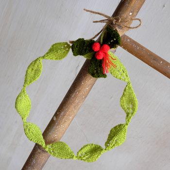 Diy Christmas wreath for decoration the door on Xmas holiday, a traditional festive in winter,  wreath make from knitted green leaf
