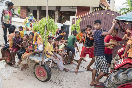 Pondicherry, Tamil Nadu,India - May 15, 2014 : each year in villages, people celebrate the temple fest, for the full day. They walk in groups, they launch paint on people, play music.