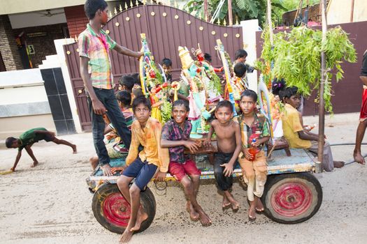 Pondicherry, Tamil Nadu,India - May 15, 2014 : each year in villages, people celebrate the temple fest, for the full day. They walk in groups, they launch paint on people, play music.