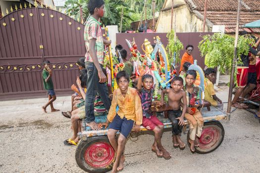 Pondicherry, Tamil Nadu,India - May 15, 2014 : each year in villages, people celebrate the temple fest, for the full day. They walk in groups, they launch paint on people, play music.