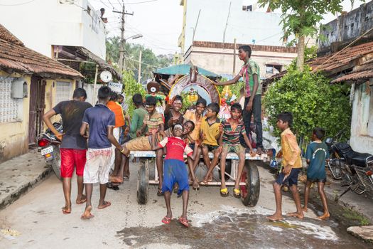 Pondicherry, Tamil Nadu,India - May 15, 2014 : each year in villages, people celebrate the temple fest, for the full day. They walk in groups, they launch paint on people, play music.