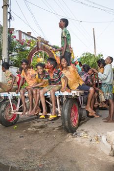 Pondicherry, Tamil Nadu,India - May 15, 2014 : each year in villages, people celebrate the temple fest, for the full day. They walk in groups, they launch paint on people, play music.