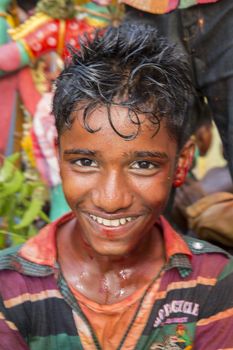 Pondicherry, Tamil Nadu,India - May 15, 2014 : each year in villages, people celebrate the temple fest, for the full day. They walk in groups, they launch paint on people, play music.