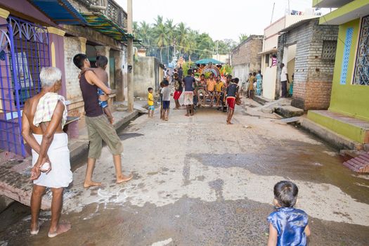 Pondicherry, Tamil Nadu,India - May 15, 2014 : each year in villages, people celebrate the temple fest, for the full day. They walk in groups, they launch paint on people, play music.