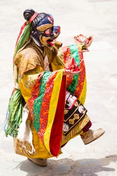 Unidentified monk performs a religious masked and costumed mystery dance of Tibetan Buddhism during the Cham Dance Festival in Hemis monastery, India.