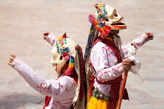 Unidentified monks performs a religious masked and costumed mystery dance of Tibetan Buddhism during the Cham Dance Festival in Hemis monastery, India