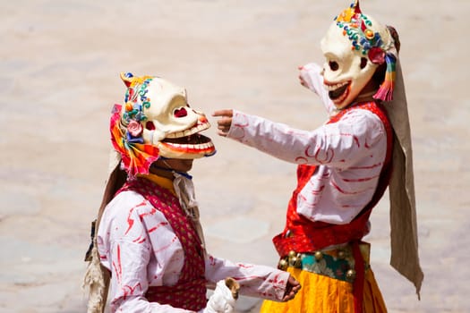 Unidentified monks performs a religious masked and costumed mystery dance of Tibetan Buddhism during the Cham Dance Festival in Hemis monastery, India