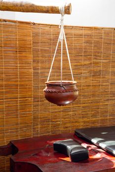 Bowl for oil and massage table for ayurvedic treatments (Kerala, India)