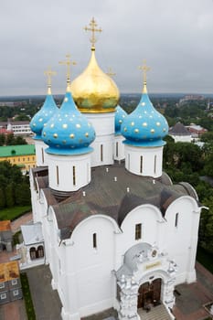 Cathedral of the Assumption of the Blessed Virgin Mary in the Trinity-Sergius Lavra. The inscription above the entrance means "The known God". Top view from the bell tower (Sergiev Posad, Russia).