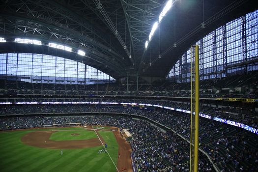 Brewers fans await a baseball game against the Chicago Cubs under a closed dome