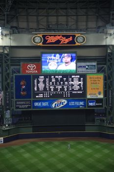 Milwaukee Brewers scoreboard and outfield during a baseball game at Miller Park against the Chicago Cubs under a closed dome.