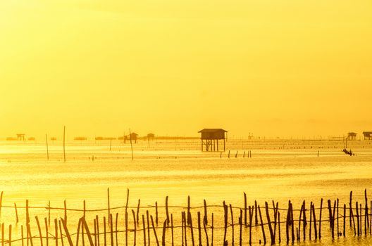 Sunrise time Thai fisherman village in Bangtaboon Petchaburi, Thailand