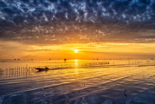 Sunrise time Thai fisherman village in Bangtaboon Petchaburi, Thailand