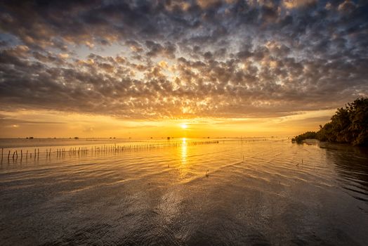 Sunrise time Thai fisherman village in Bangtaboon Petchaburi, Thailand