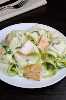 Zucchini salad with slices of chicken breast in milk sauce and dill
