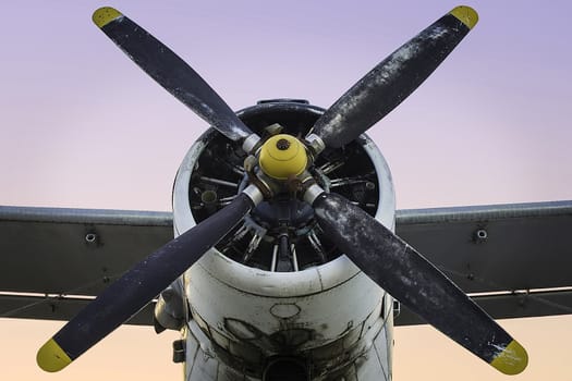 Old single engine propeller airplane in dust