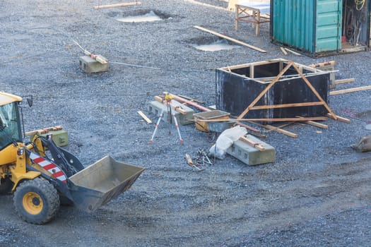 View of a construction site with various machines and bulldozers