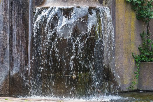 Artificially designed waterfall, fountain - Fountain in a park.