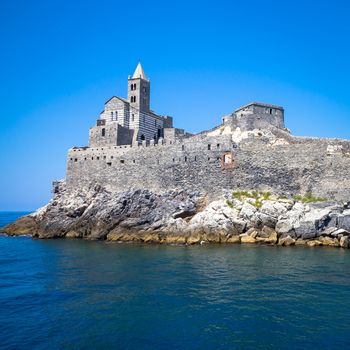 Bright colors in this panorama from the sea of San Pietro Church in Porto Venere, Italy