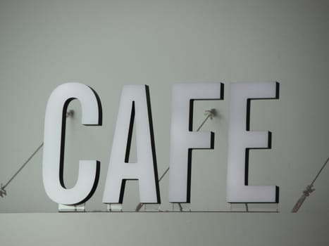 White 3D Cafe Sign Letters Mounted Secure with Wires