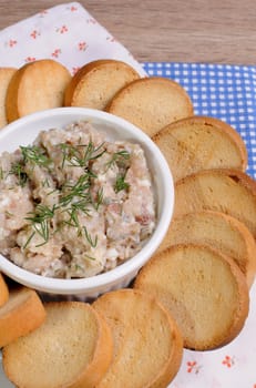 Appetizer of fish paste (forshmak ) with slices of dried baguette