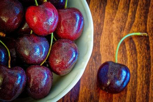 fresh black cherries in bowl, close up