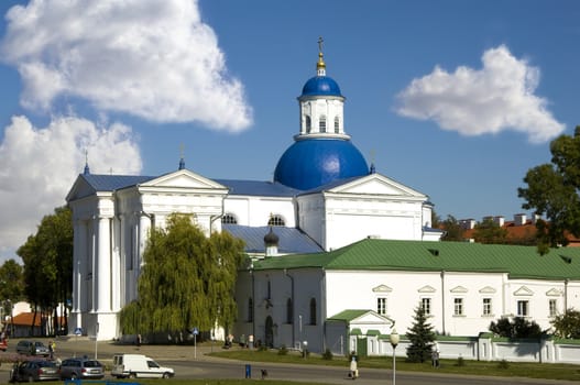 Zhirovichi monastery in Belarus wint blue sky and clouds on background