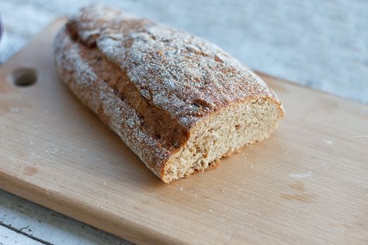 Fresh bread slice on a rustic table