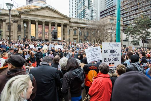 Protesters rally against the torture and detention of indigenous children in the Northern Territory. The rally was held outside the State Library.