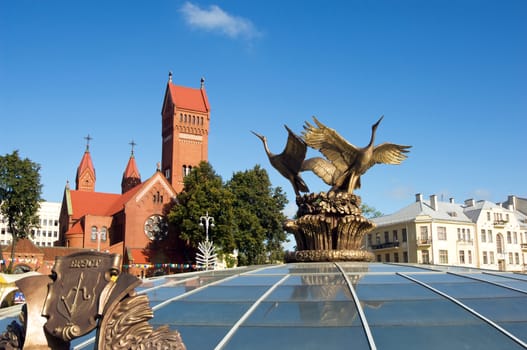 Red Church and Stork statue of Independence Square, Minsk, Belarus