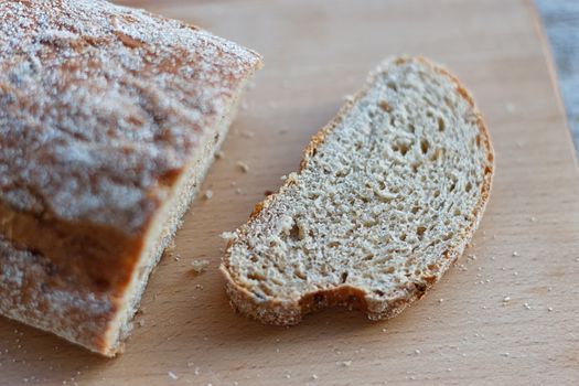 Fresh bread slice on a rustic table