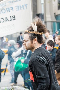 Protesters rally against the torture and detention of indigenous children in the Northern Territory. The rally was held outside the State Library.