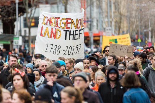 Protesters rally against the torture and detention of indigenous children in the Northern Territory. The rally was held outside the State Library.