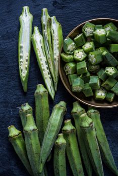 Sliced farm fresh okra in rustic bowl