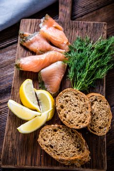 Healthy brunch smoked salmon with cottage cheese on wooden rustic board