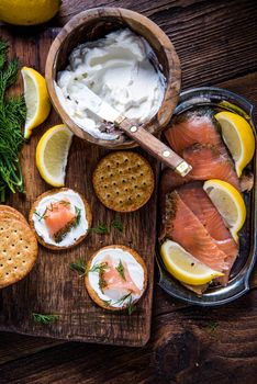 Oat crackers with smoked salmon and cottage cheese, from overhead