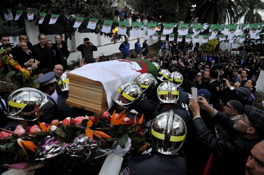 ALGERIA, Algiers : Algerians pay tribute to late Algerian opposition figure Hocine Ait-Ahmed, on December 31, 2015 in the capital Algiers after his body was brought to his homeland for a state funeral. Ait-Ahmed, one of the fathers of Algeria's struggle for independence from France and then a longtime opposition figure, died in Lausanne, Switzerland on December 23, his Socialist Forces Front party said. Ait-Ahmed, 89, was the last of the nine so-called sons of Toussaint, who launched the uprising in November 1954.