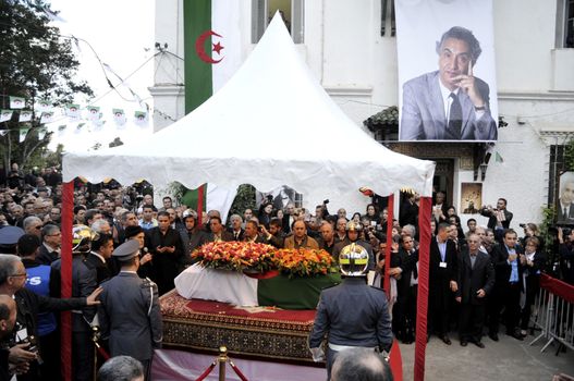 ALGERIA, Algiers : Algerians pay tribute to late Algerian opposition figure Hocine Ait-Ahmed, on December 31, 2015 in the capital Algiers after his body was brought to his homeland for a state funeral. Ait-Ahmed, one of the fathers of Algeria's struggle for independence from France and then a longtime opposition figure, died in Lausanne, Switzerland on December 23, his Socialist Forces Front party said. Ait-Ahmed, 89, was the last of the nine so-called sons of Toussaint, who launched the uprising in November 1954.