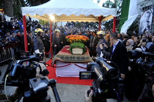 ALGERIA, Algiers : Algerians pay tribute to late Algerian opposition figure Hocine Ait-Ahmed, on December 31, 2015 in the capital Algiers after his body was brought to his homeland for a state funeral. Ait-Ahmed, one of the fathers of Algeria's struggle for independence from France and then a longtime opposition figure, died in Lausanne, Switzerland on December 23, his Socialist Forces Front party said. Ait-Ahmed, 89, was the last of the nine so-called sons of Toussaint, who launched the uprising in November 1954.