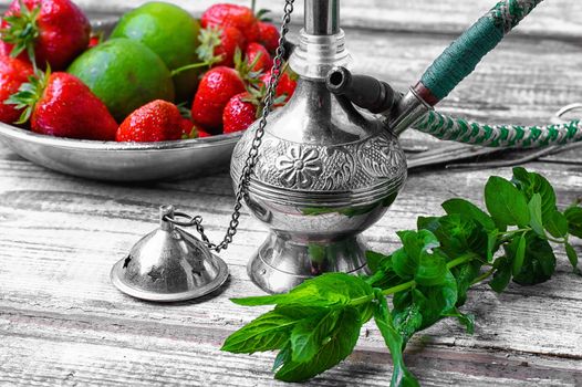 Small smoking hookah with strawberry,mint and lime