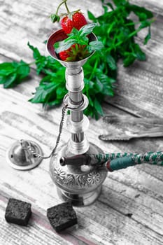 Small smoking hookah with strawberry,mint and lime