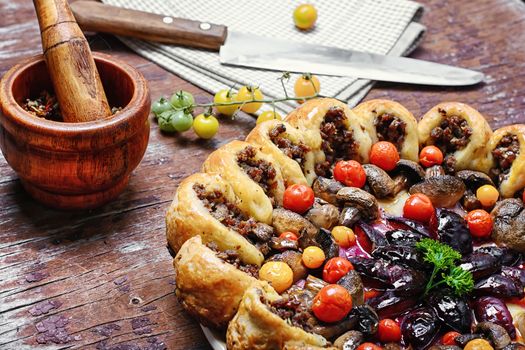 Meat pie and mortar with sharp spices according to traditional recipe in rustic style