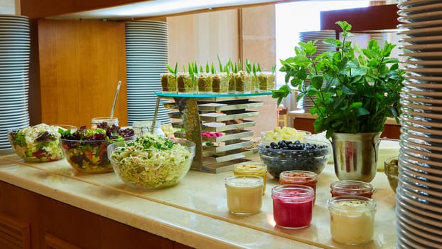 Selection of salads at a buffet bar in a luxury hotel restaurant.